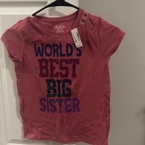 Mauve shade tshirt. Still has tags. World’s best big sister.